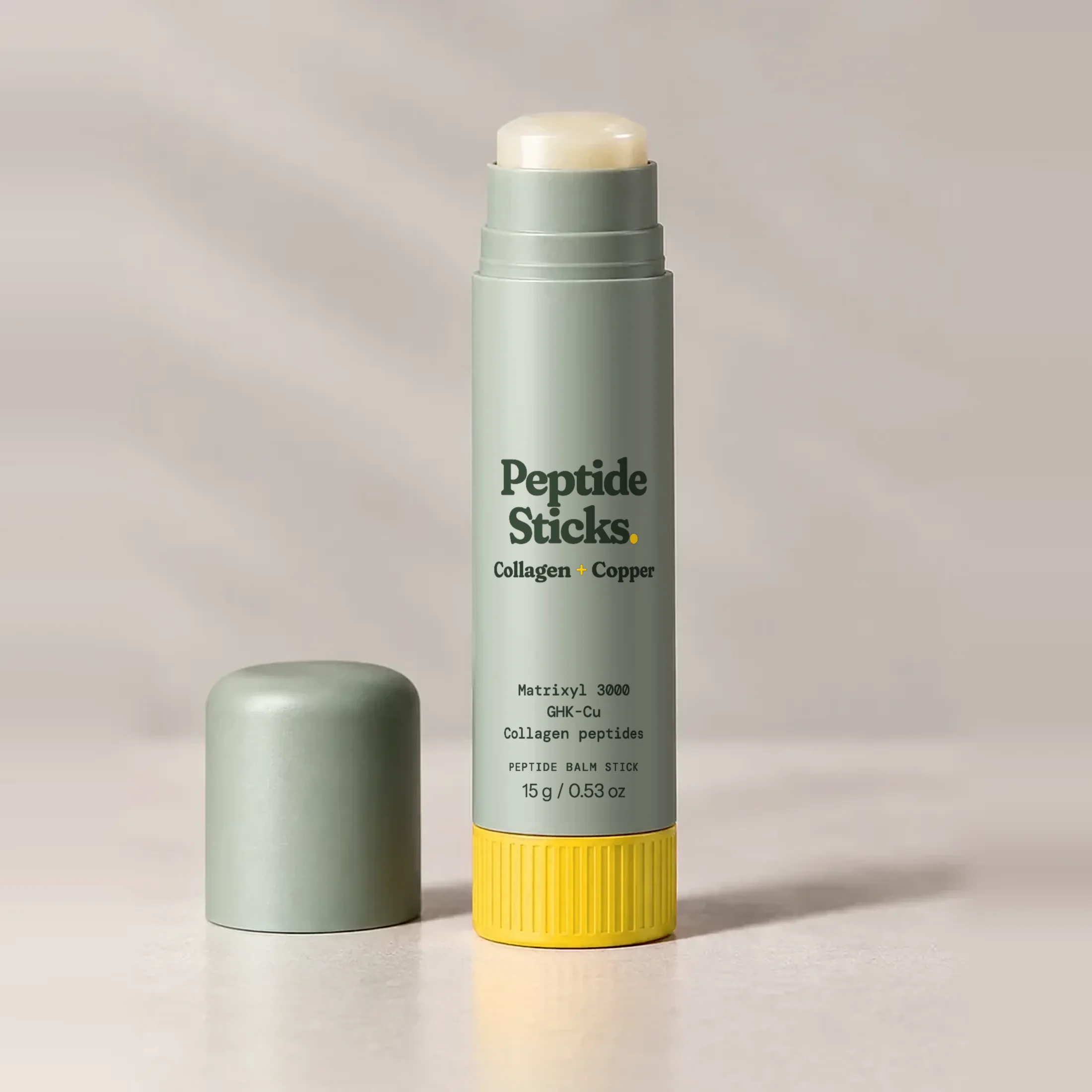The open Collagen + Copper Stick with its balm twisted up